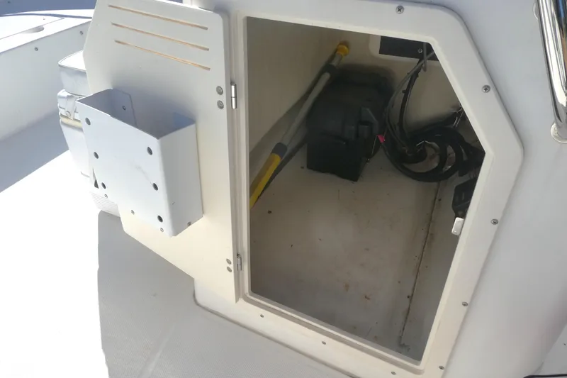 Slide: The Image of Open storage compartment on a 2010 Boston Whaler 190 Montauk boat. - 6
