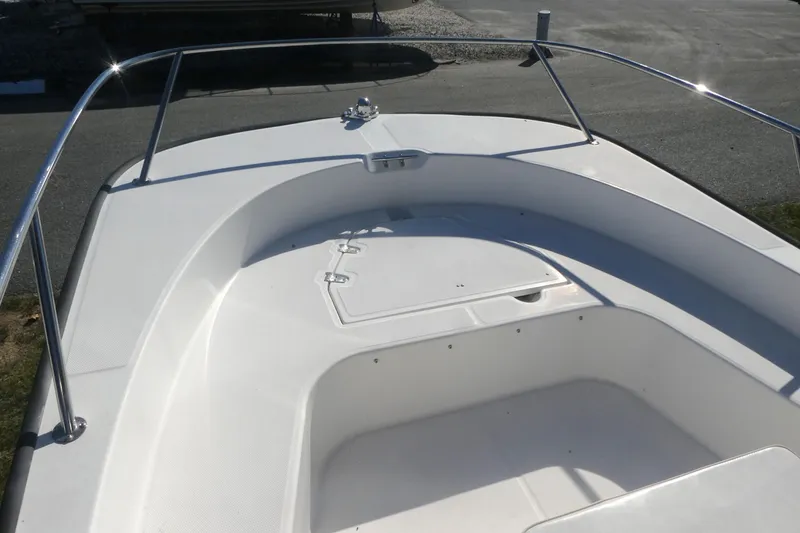 Slide: The Image of 2010 Boston Whaler 190 Montauk boat deck with stainless steel railing. - 7