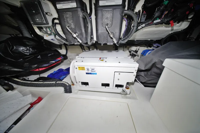 Slide: The Image of Engine room of 2023 Galeon 400 XL yacht, showcasing mechanical components and wiring. - 12