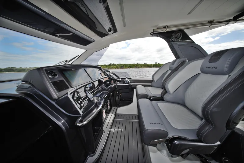 Slide: The Image of Interior of 2023 Galeon 400 XL yacht with modern dashboard and luxurious seating. - 19