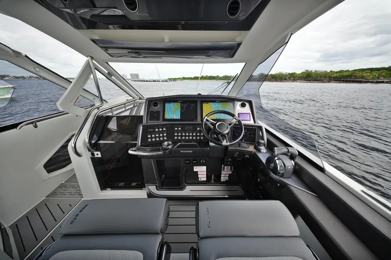 Slide: The Image of 2023 Galeon 400 XL yacht cockpit with advanced navigation system and luxurious seating. - 22