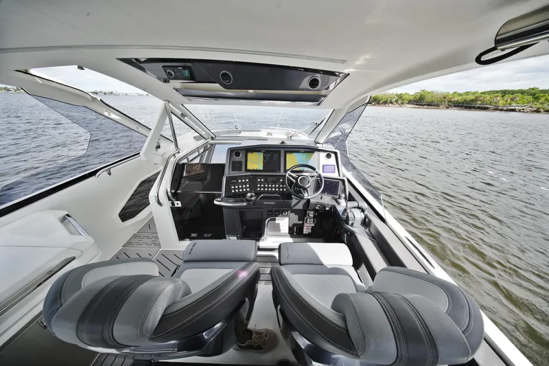Slide: The Image of Interior view of 2023 Galeon 400 XL yacht cockpit with modern controls and dual seats. - 24
