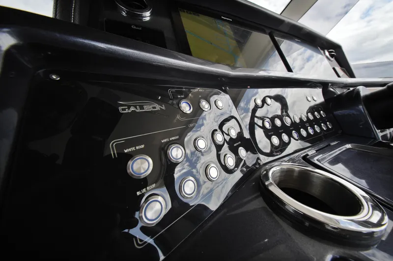Slide: The Image of Control panel of 2023 Galeon 400 XL yacht with buttons and cup holder. - 25