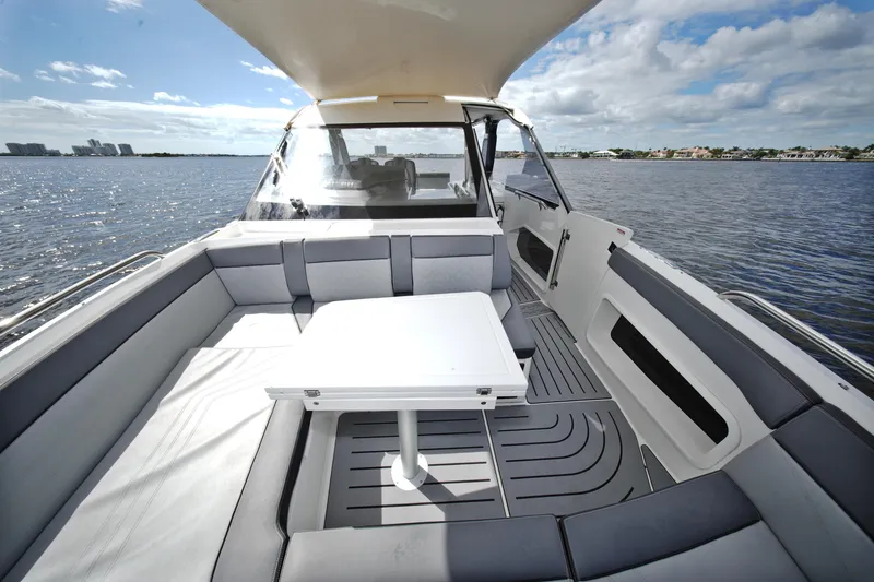 Slide: The Image of 2023 Galeon 400 XL yacht interior with seating and table on open water. - 29