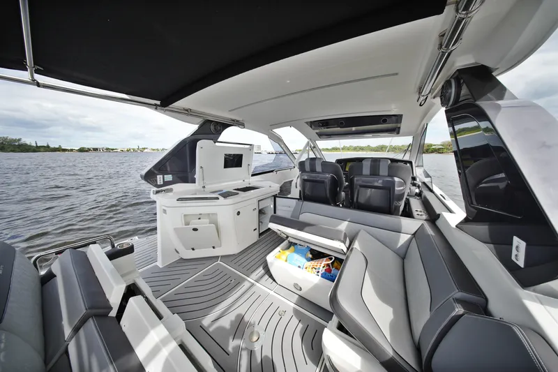 Slide: The Image of 2023 Galeon 400 XL yacht interior with sleek seating and modern amenities on open water. - 31