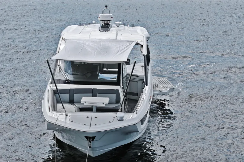 Slide: The Image of 2023 Galeon 400 XL yacht on water, featuring sleek design and spacious deck. - 49