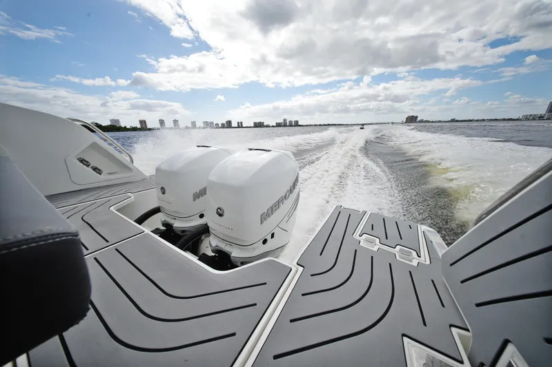 Slide: The Image of 2023 Galeon 400 XL boat with dual Mercury engines cruising on open water. - 6