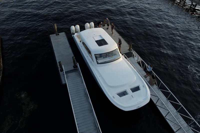 Slide: The Image of Aerial view of 2026 Front Runner 43' HTX yacht docked at marina. - 2