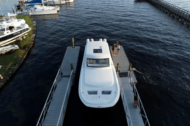 Slide: The Image of 2026 Front Runner 43' HTX yacht docked at marina, aerial view. - 3