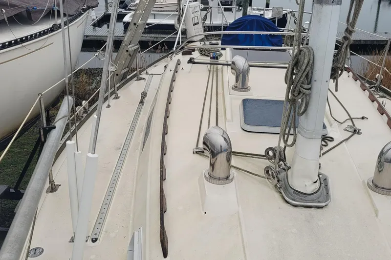 Slide: The Image of 1986 Sabre 34 sailboat deck with rigging and fittings in a marina. - 16