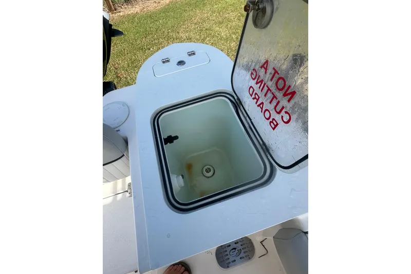 Slide: The Image of Open compartment on 2023 Sea Fox 228 Commander boat with "Not a Cutting Board" label. - 12