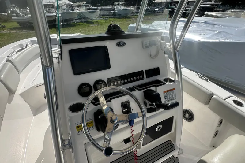 Slide: The Image of 2023 Sea Fox 228 Commander boat dashboard with steering wheel and controls. - 13