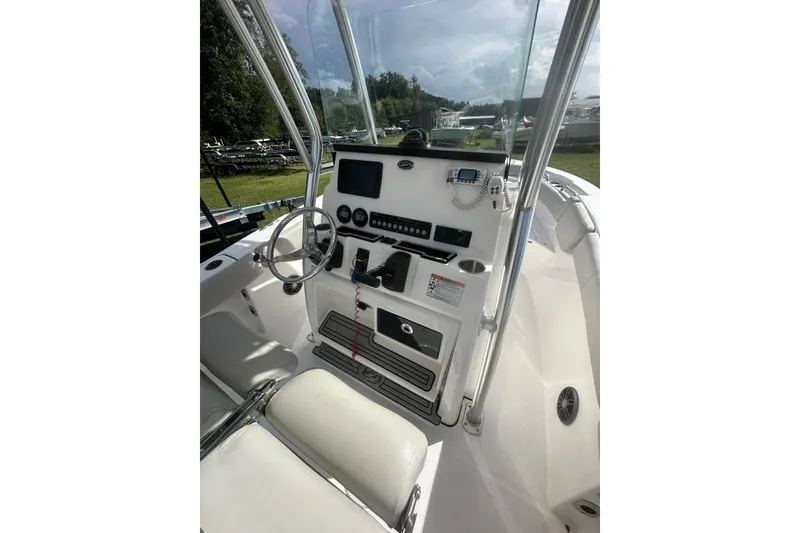 Slide: The Image of 2023 Sea Fox 228 Commander boat cockpit with steering wheel and control panel. - 21