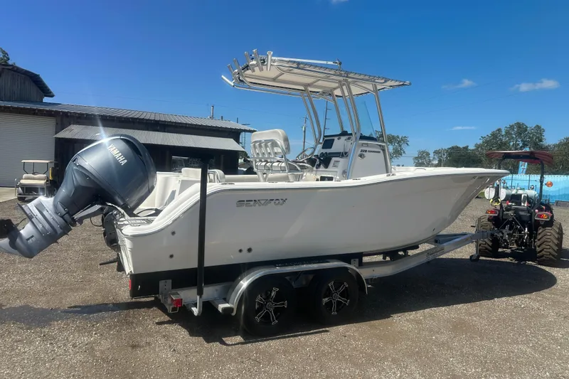 Slide: The Image of 2023 Sea Fox 228 Commander boat on trailer with Yamaha engine, parked outdoors. - 29