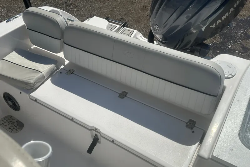 Slide: The Image of 2023 Sea Fox 228 Commander boat interior with Yamaha engine, featuring cushioned seating. - 32