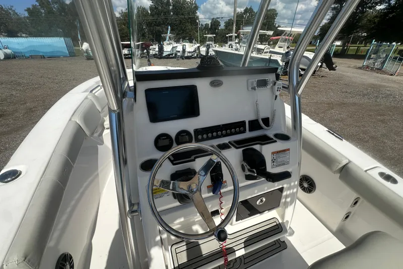 Slide: The Image of 2023 Sea Fox 228 Commander boat dashboard with steering wheel and controls. - 35