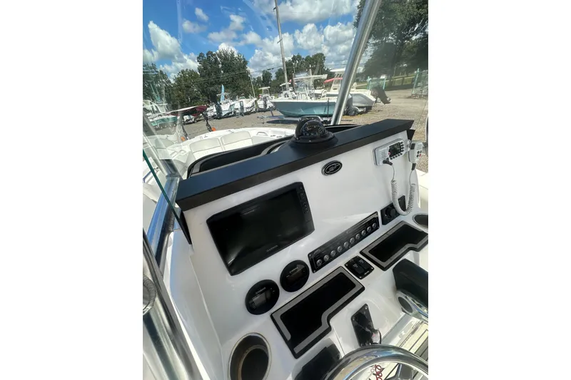 Slide: The Image of 2023 Sea Fox 228 Commander boat dashboard with navigation controls and communication equipment. - 36
