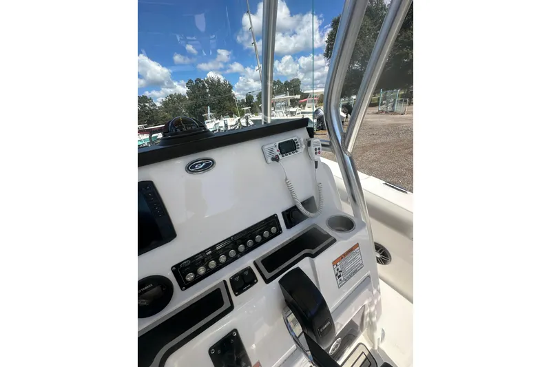 Slide: The Image of 2023 Sea Fox 228 Commander boat console with controls and navigation equipment. - 38