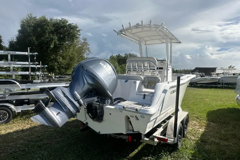 Slide: The Image of 2023 Sea Fox 228 Commander boat with Yamaha engine on trailer, parked on grass. - 4