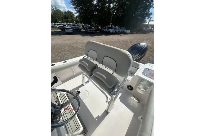 Slide: The Image of 2023 Sea Fox 228 Commander boat interior with seating and steering wheel. - 48