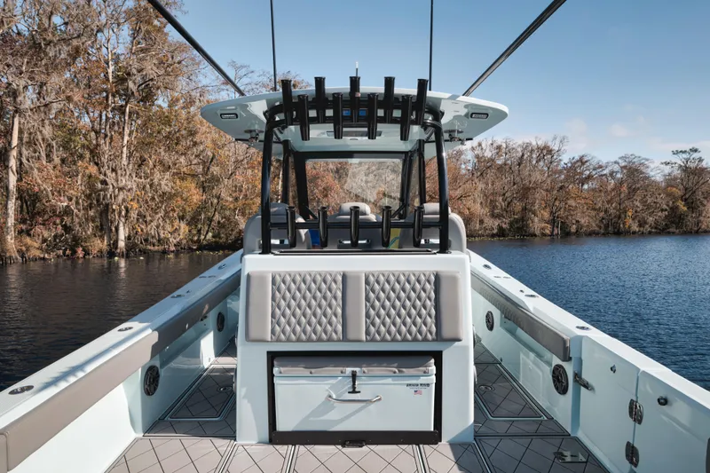 Slide: The Image of 2026 Front Runner 39' Center Console boat on a serene lake with autumn trees. - 10