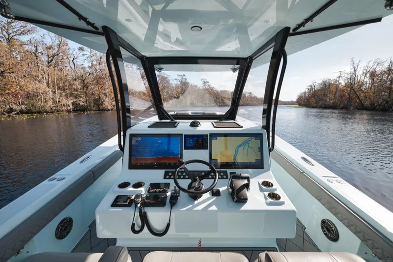 Slide: The Image of 2026 Front Runner 39' Center Console boat interior with advanced navigation system. - 16