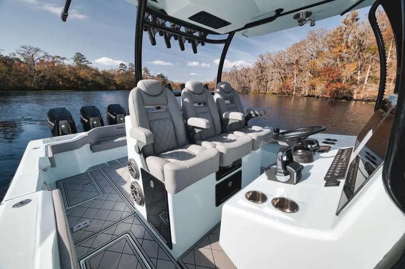 Slide: The Image of 2026 Front Runner 39' Center Console boat interior with luxurious seating and advanced controls. - 19