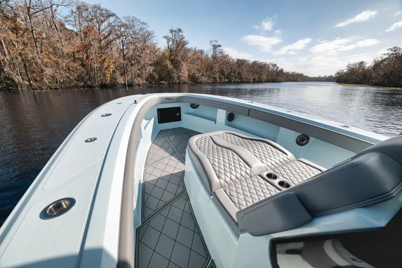 Slide: The Image of 2026 Front Runner 39' Center Console boat on a serene river with lush trees. - 20