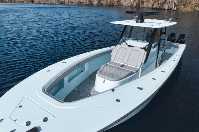 Slide: The Image of 2026 Front Runner 39' Center Console boat on calm water, showcasing sleek design. - 5