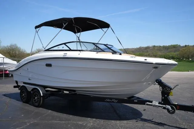 Slide: The Image of 2026 Sea Ray SPX 210 boat on trailer, featuring sleek design and black canopy. - 20