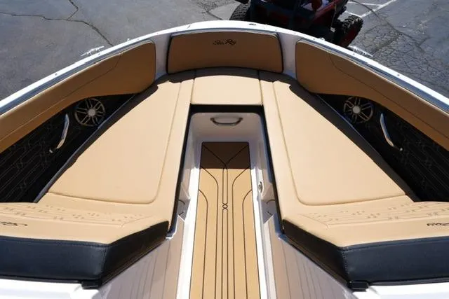 Slide: The Image of 2026 Sea Ray SPX 210 boat interior with tan and black seating. - 26
