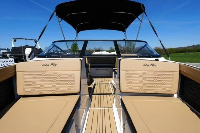 Slide: The Image of 2026 Sea Ray SPX 210 boat interior with tan seating and sleek design. - 28