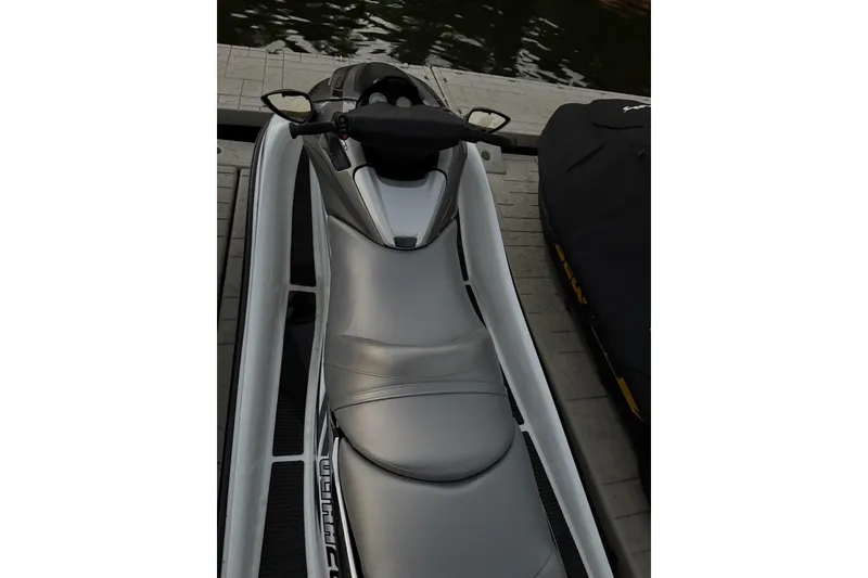 Slide: The Image of 2009 Kawasaki Jet Ski Ultra 260LX docked, showcasing sleek design and seating. - 3