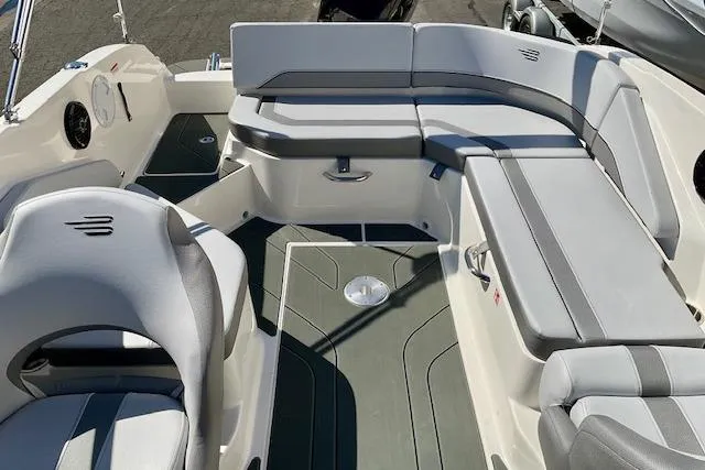 Slide: The Image of 2025 Bayliner V20 boat interior with gray seating and modern design. - 6