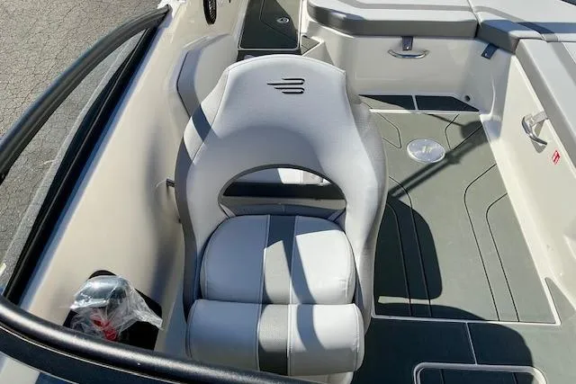 Slide: The Image of 2025 Bayliner V20 boat interior with gray seating and modern design. - 7