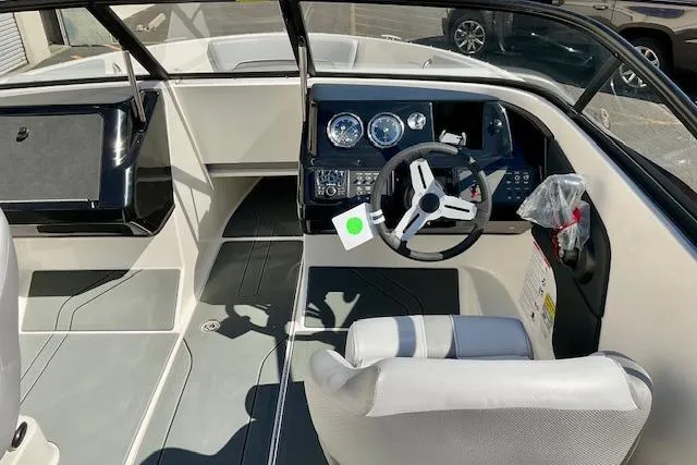 Slide: The Image of 2025 Bayliner V20 boat interior with modern dashboard and steering wheel. - 9