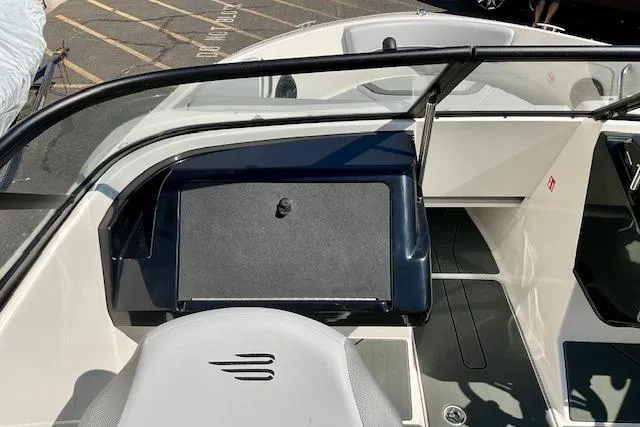 Slide: The Image of 2025 Bayliner V20 boat interior with sleek dashboard and seating. - 10