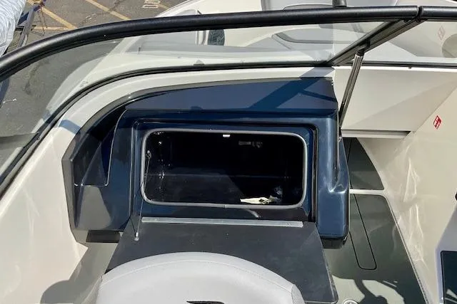 Slide: The Image of 2025 Bayliner V20 boat interior with open storage compartment. - 11