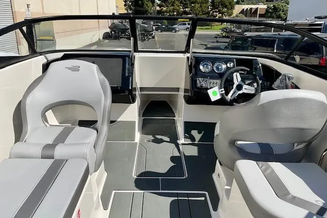 Slide: The Image of 2025 Bayliner V20 boat interior with modern dashboard and seating. - 13