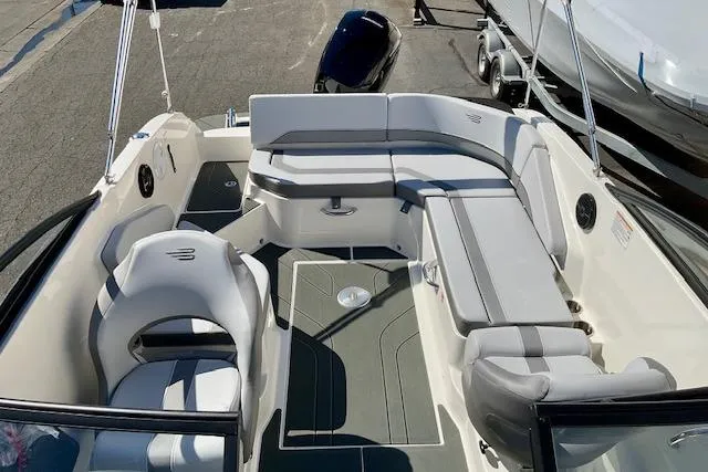 Slide: The Image of 2025 Bayliner V20 boat interior with spacious seating and modern design. - 8