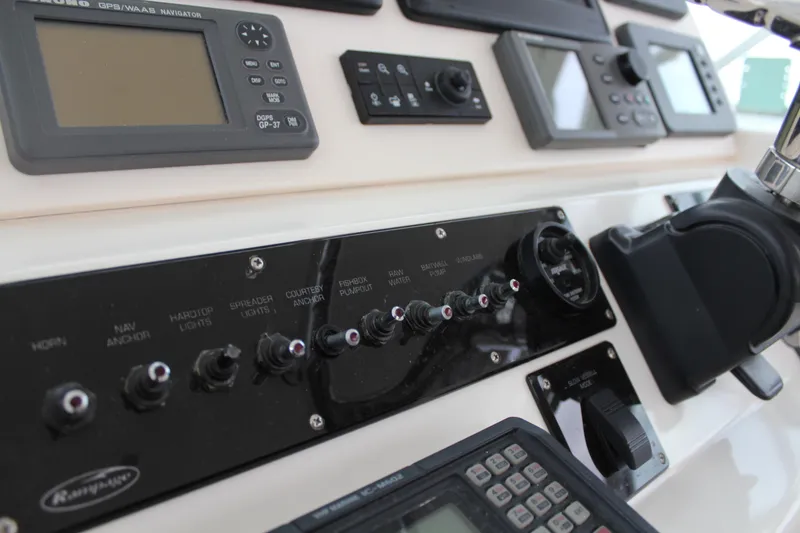Slide: The Image of Control panel of a 2005 Rampage 38 Express boat with navigation instruments. - 18