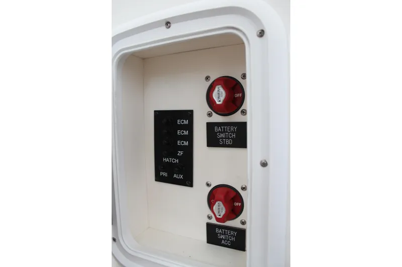 Slide: The Image of Control panel of a 2005 Rampage 38 Express boat with battery switches and labels. - 21