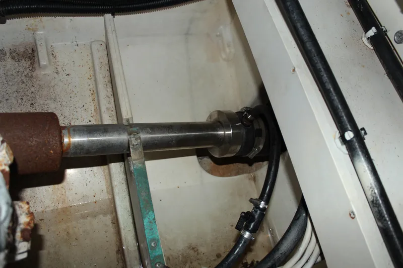 Slide: The Image of Engine compartment of 2005 Rampage 38 Express boat showing shaft and hoses. - 39