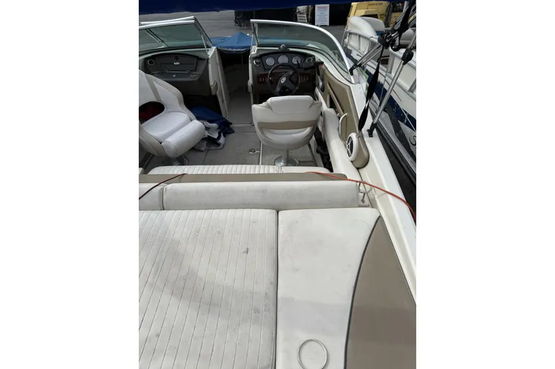 Slide: The Image of 2007 Sea Ray 210 Select boat interior with seating and steering wheel. - 6