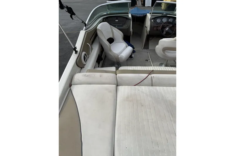 Slide: The Image of 2007 Sea Ray 210 Select boat interior with white seating and dashboard view. - 7