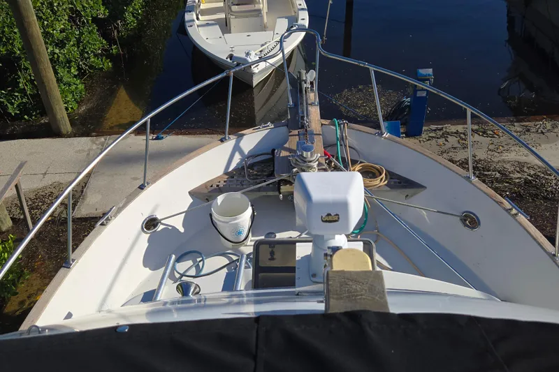 Slide: The Image of 1983 Custom Present 38 Double Cabin Trawler bow view with nautical equipment. - 12