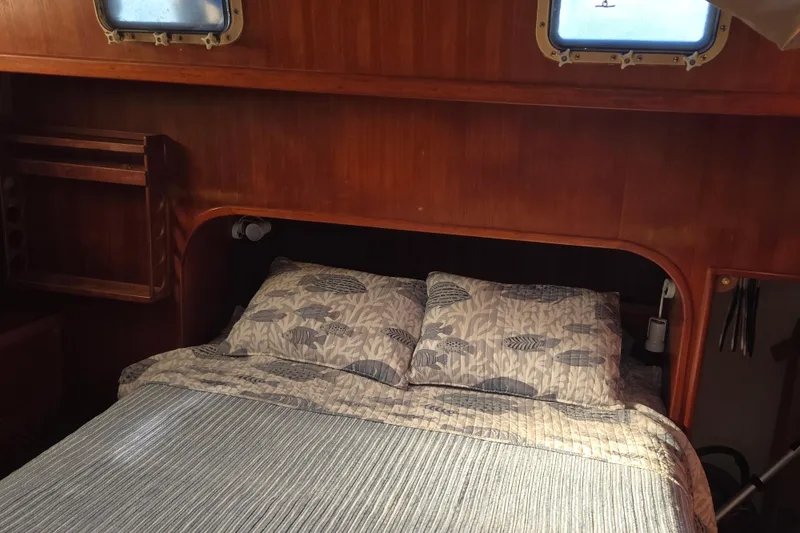 Slide: The Image of Cozy cabin bedroom in 1983 Custom Present 38 Double Cabin Trawler with wooden interior. - 24