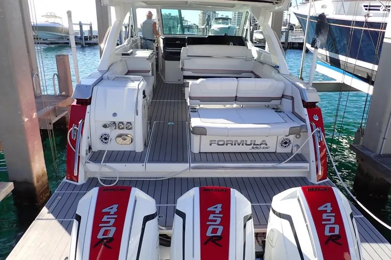 Slide: The Image of 2023 Formula 380 Super Sport Crossover OB with triple Mercury 450R engines docked at marina. - 3