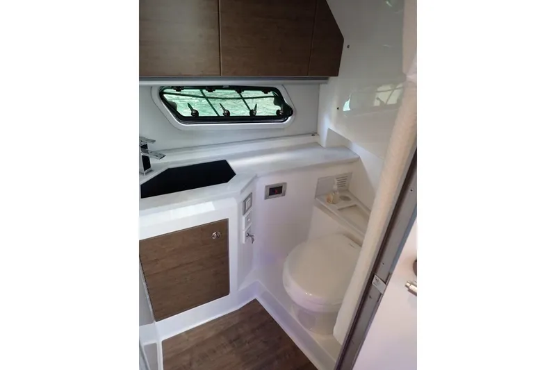 Slide: The Image of 2023 Formula 380 Super Sport Crossover OB boat interior bathroom with modern design. - 4