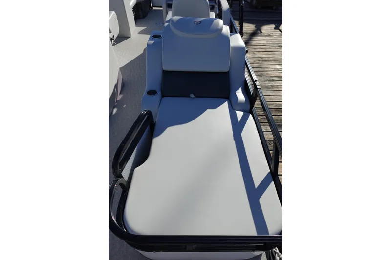 Slide: The Image of 2020 Tahoe Pontoon 2485 LTZ Rear Lounger with comfortable seating on a sunny deck. - 18